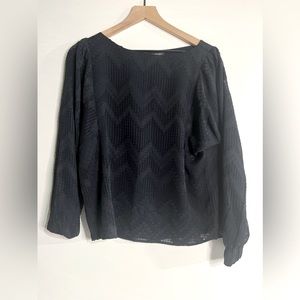 Women’s black short sleeve top with square patterns